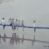 Vietnamese kids playing on a pipe over part of the Perfume River