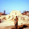 Perry near the sand pile.Who took all the sandbags?