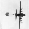 Photo taken by the author, while hanging suspended from his parachute, of one of his classmates "tailgating" a C130. Ft Bragg, North Carolina 1967